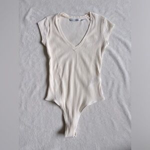 Calvin Klein cream bodysuit